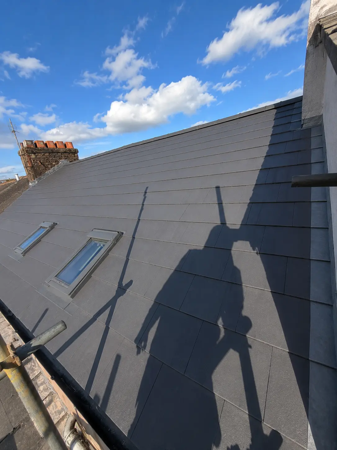 Full re-roof with new slate tiles and roof windows